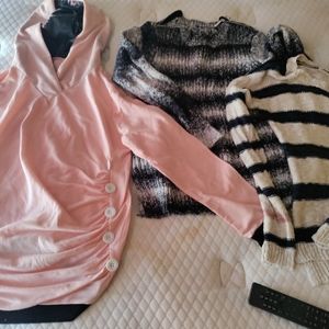 Three women's sweaters